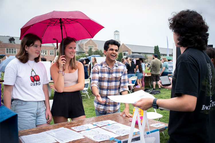 students at Activities Fair table