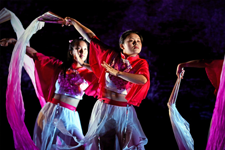 Dancers wave scarfs during Lunar New Year performance